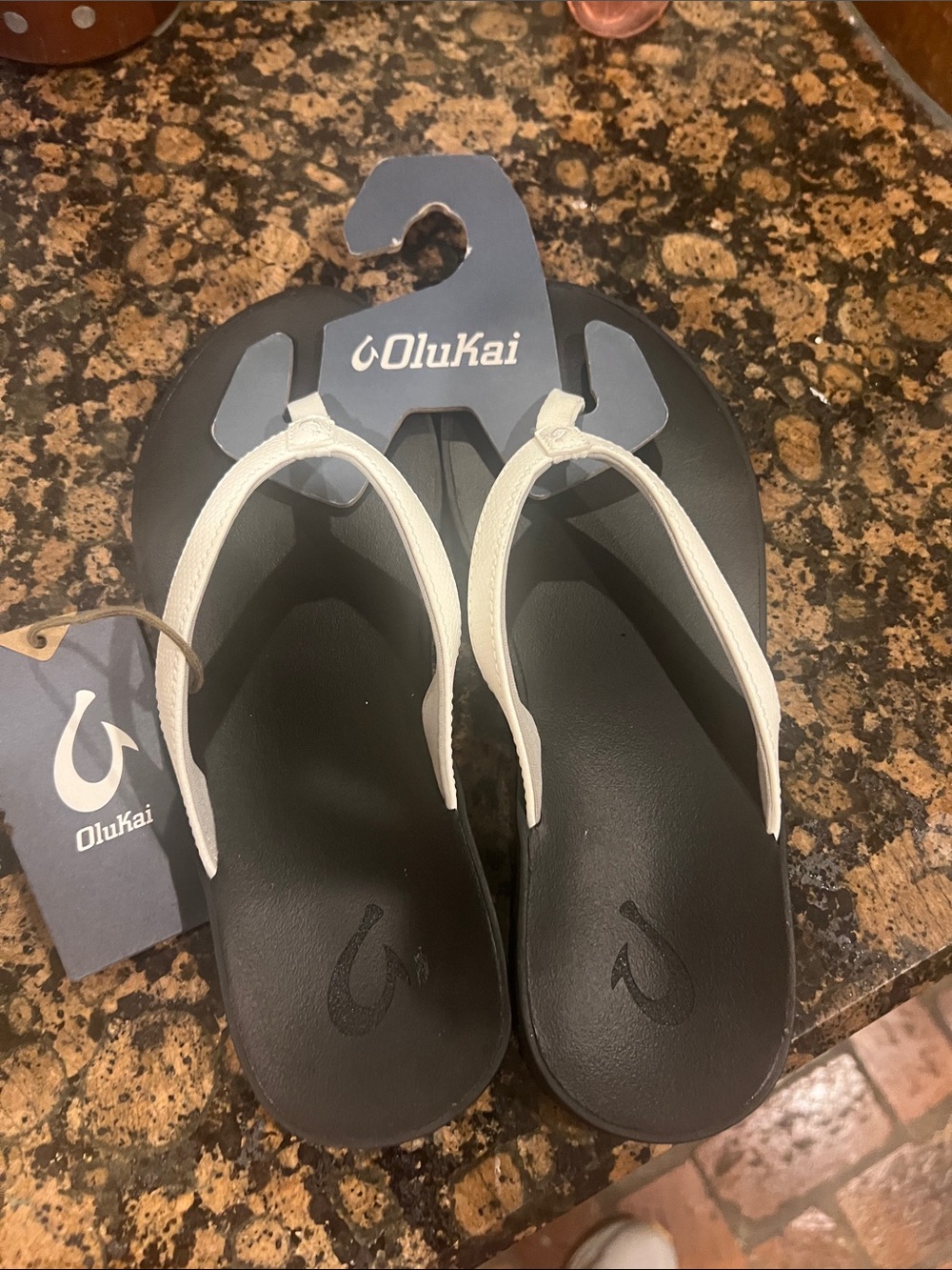 OluKai Women's Black Footbed White Strap Flip Flop Sandals